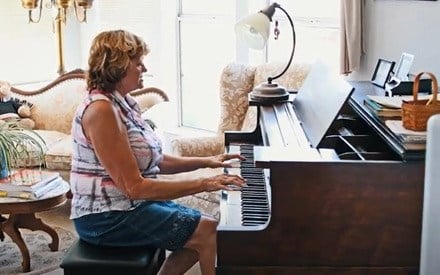 A woman playing the piano.