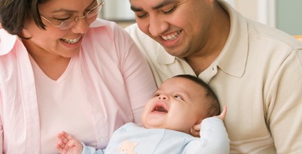 Parents holding their baby.